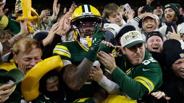 Love leads Packers past Panthers in vital win