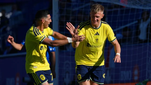 Sam Surridge (R) celebrates with Cristian Espinoza after scoring for Nashville against CF Montréal.