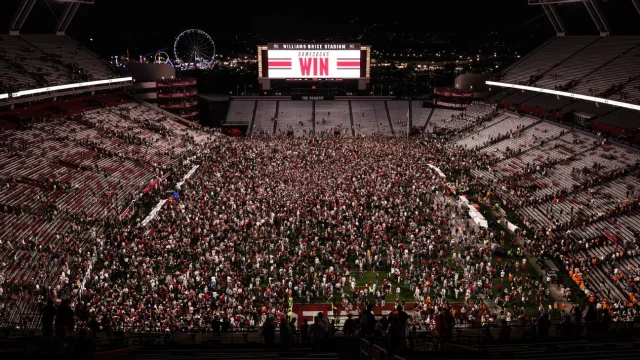 South Carolina fans storm the field after beating the Tennessee Volunteers on Saturday.