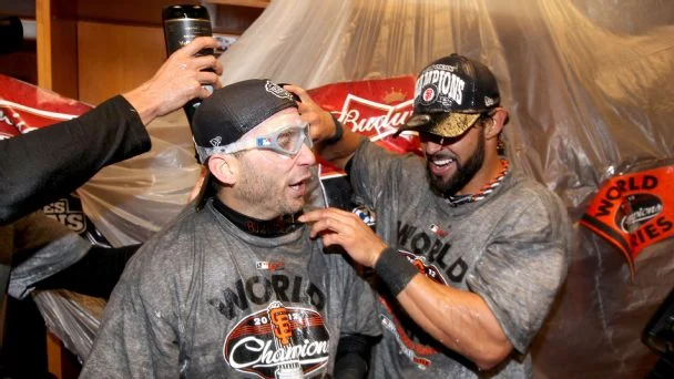 Marco Scutaro and Angel Pagan of the San Francisco Giants celebrate after sweeping the Detroit Tigers in the 2012 World Series.