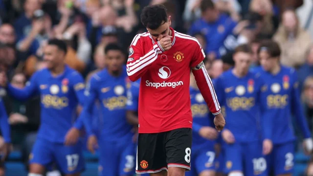 Bruno Fernandes of Manchester United reacts after Cole Palmer of Chelsea scores his team’s second goal