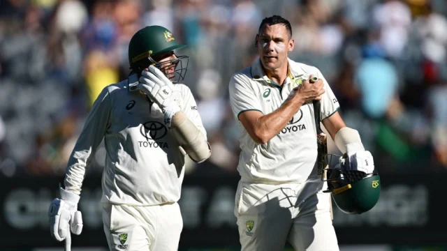 Nathan Lyon and Scott Boland walk off at stumps after keeping India at bay for 110 balls