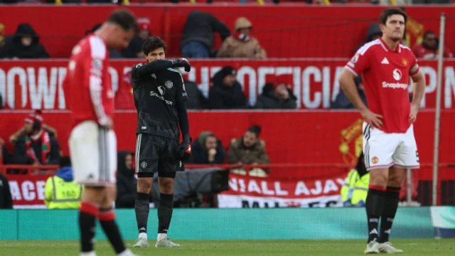 Manchester United's Belgian goalkeeper #01 Senne Lammens (C) reacts after making an error for Bournemouth's third goal
