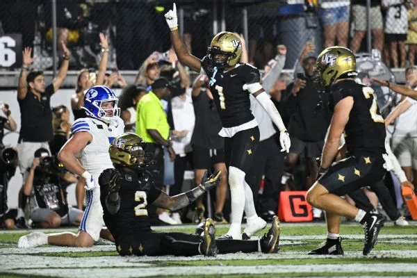 UCF celebrates after a defensive stop on fourth down seals a thrilling double-overtime win over No. 2 BYU.