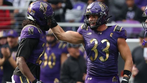 Braydon Brus, right, and Jon Jon Stevens celebrate during a win over Rutgers that kept Northwestern on the rise.