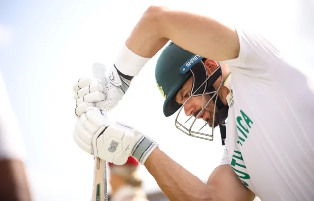 Aiden Markram mimes a stroke while walking out to bat