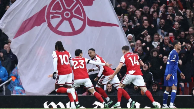 Arsenal's English defender #15 Ezri Konsa (C) celebrates with teammates