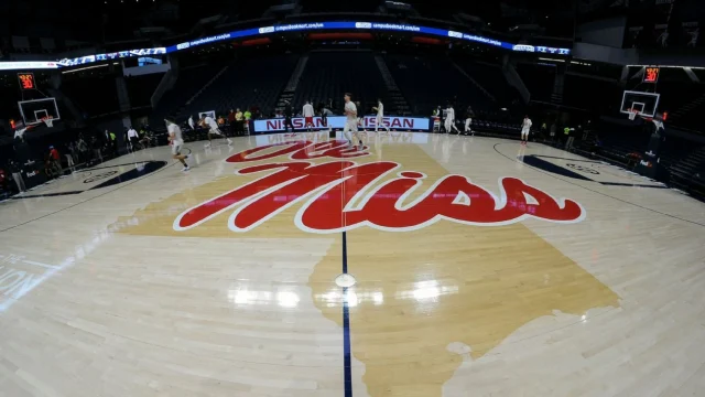 Ole Miss sanctioned over ex-assistant's talks with athlete adviser