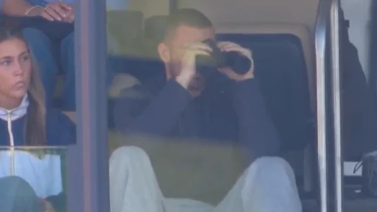CJ Carr watches his brother Tommy at Michigan Stadium in Ann Arbor.